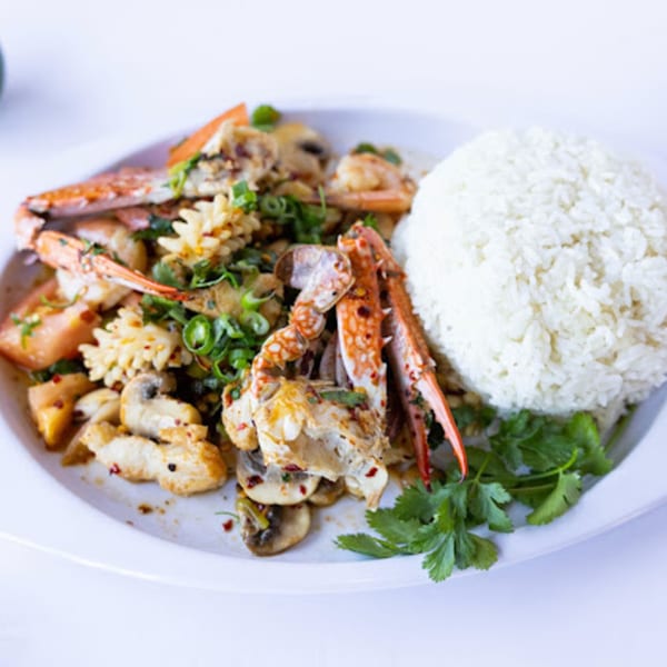 TG Thai Food's spicy seafood stir-fry with crab, squid, shrimp, mushrooms, and rice.
