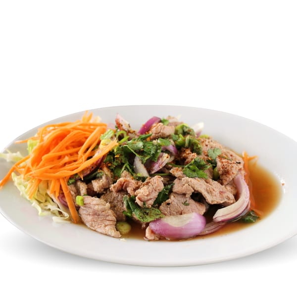 TG Thai Food's spicy beef salad with red onions, cilantro, and shredded carrots.